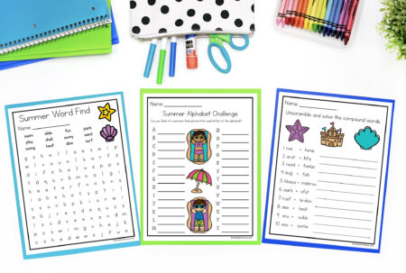Summer-themed Printables on a table top surrounded by school supplies